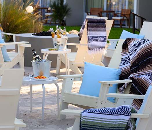chairs and tables on a beach