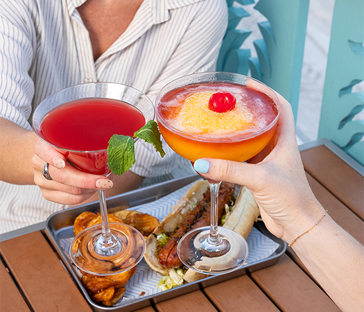 a woman holding a drink