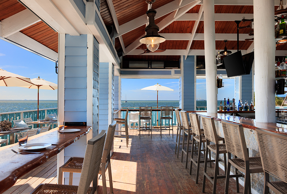 a restaurant with a view of the ocean