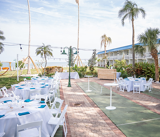 a group of tables and chairs outside
