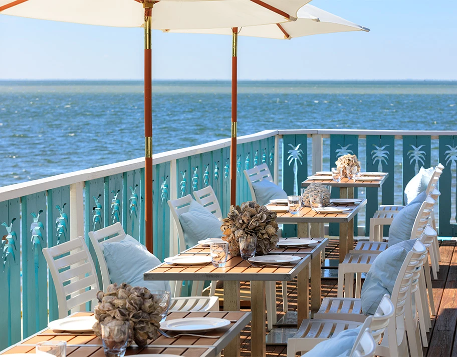 Outdoor dining area with a water view