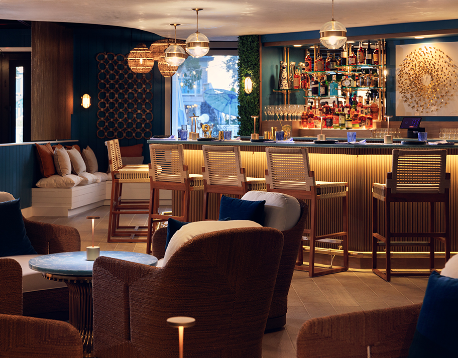 a bar with chairs and tables