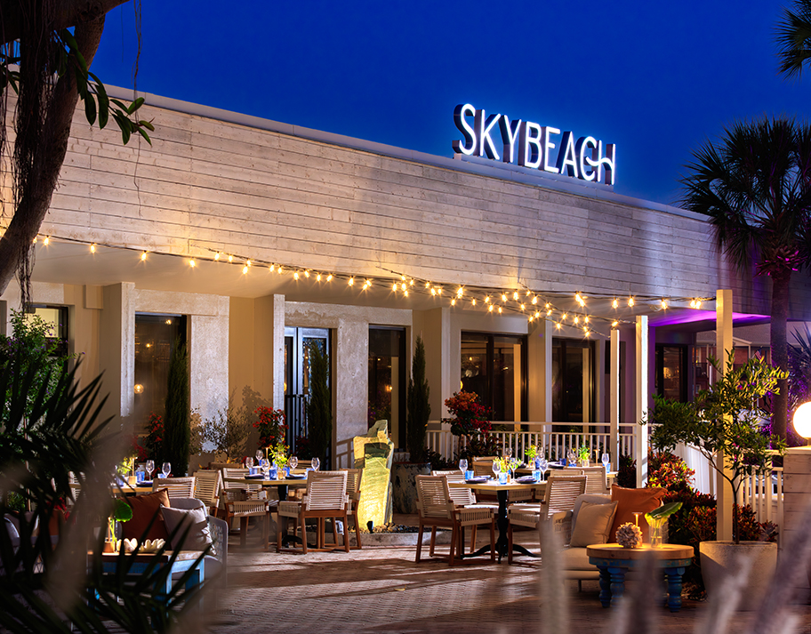 a restaurant with tables and chairs outside