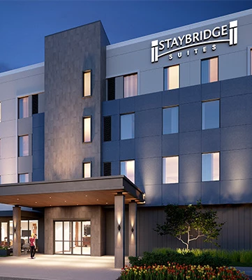 entrance of the Staybridge Suites property during the evening