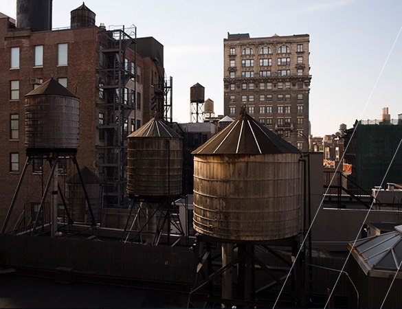 large elevated wooden bins on a rooftop in the city