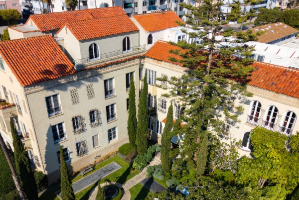 a building with trees and a fountain