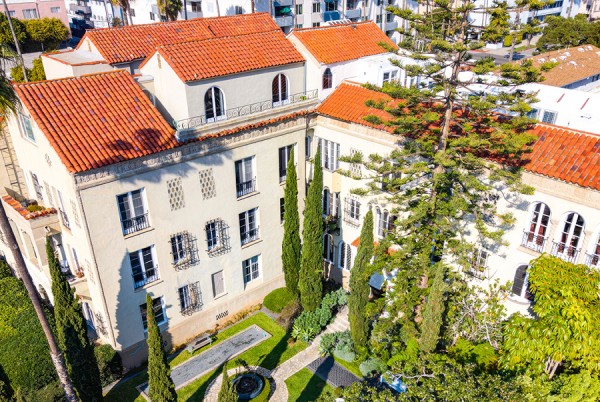 a building with trees and a fountain