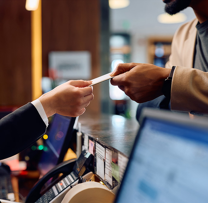 a person handing a card to another person