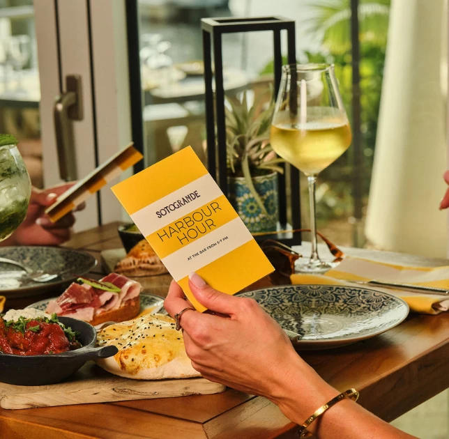 a person holding a yellow card