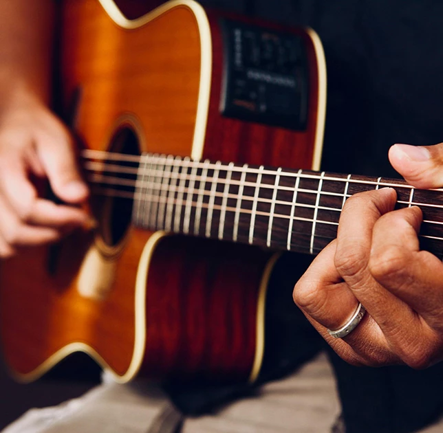 a person playing a guitar