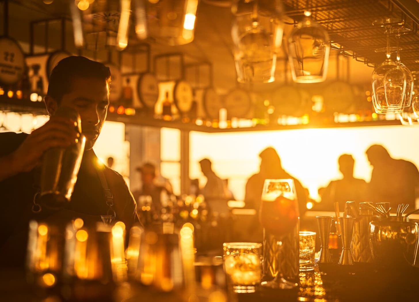 a man pouring a drink into a glass