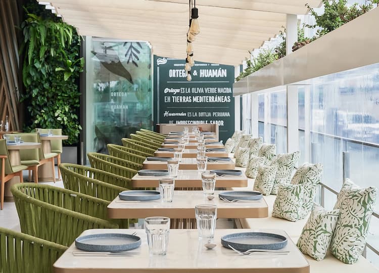 a long table with plates and glasses