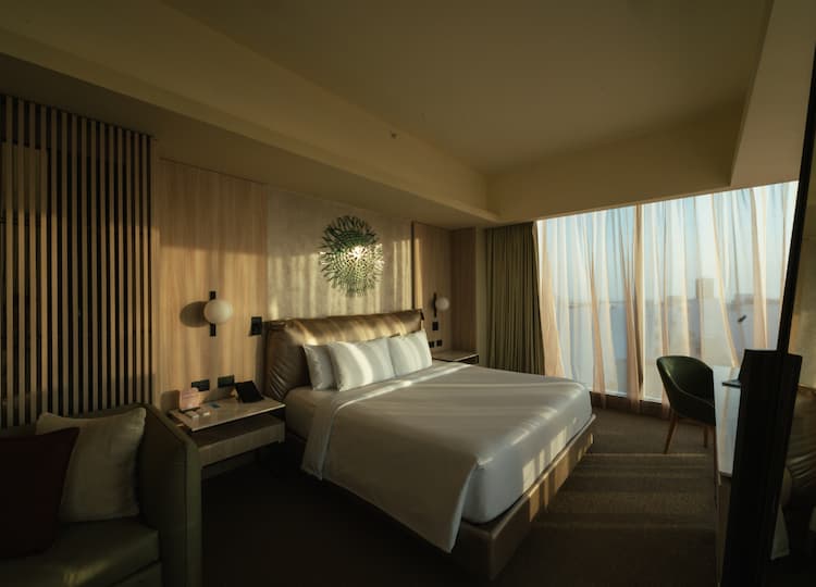 a room with a bed and a chair