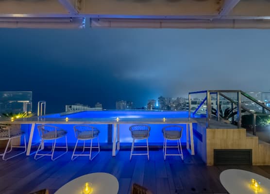 hero image for a rooftop bar with blue lights