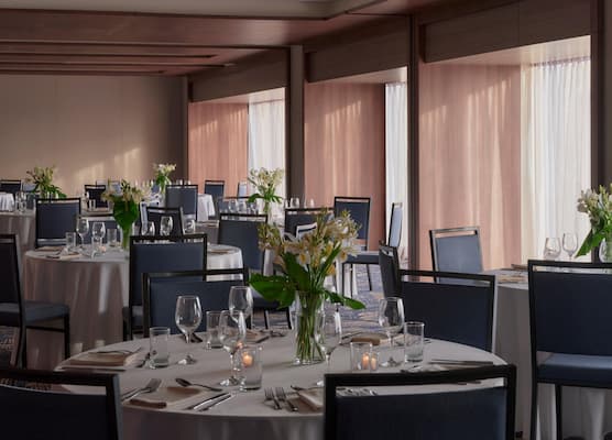 Post image for a room with tables and chairs