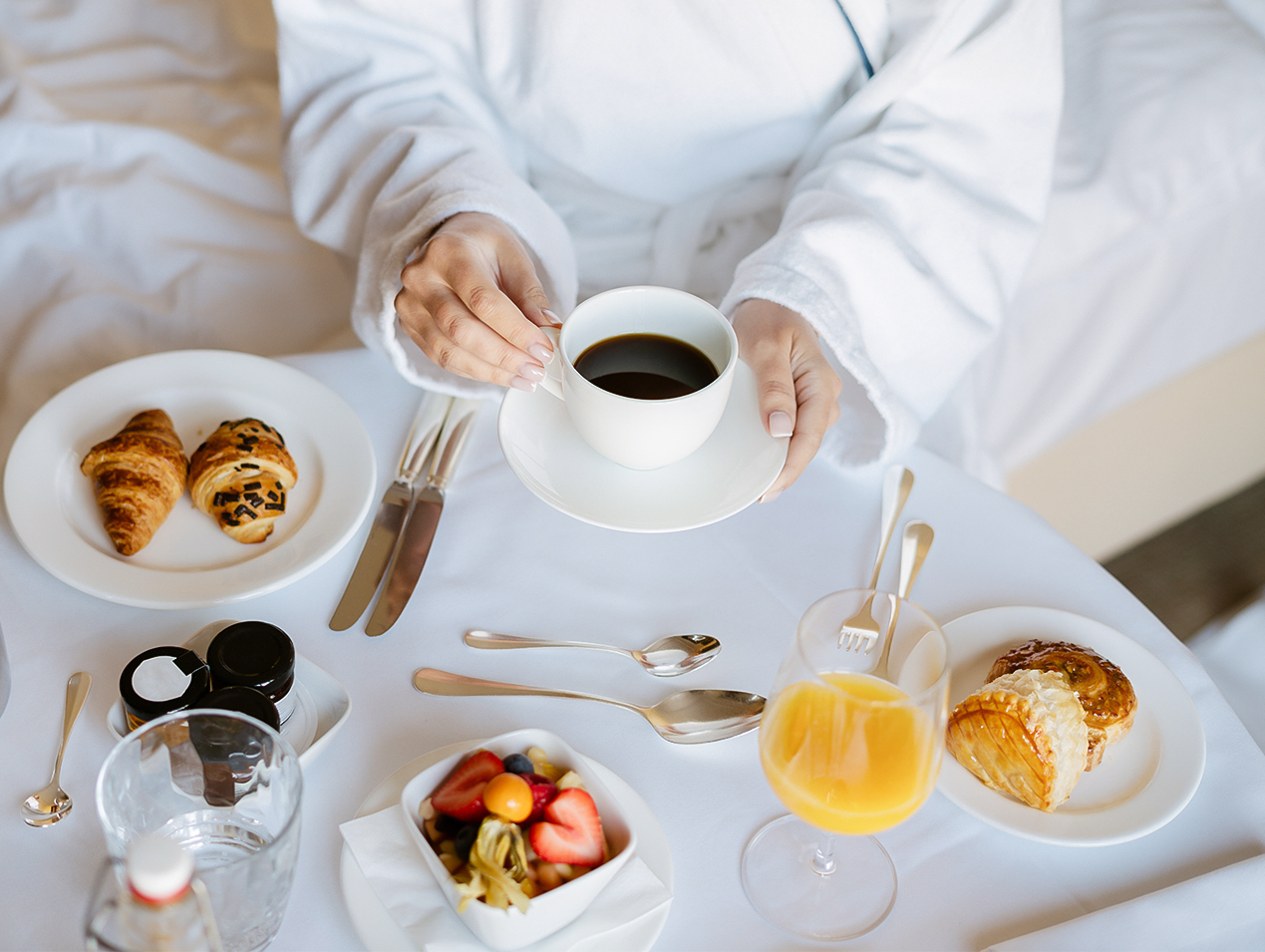 a person holding a cup of coffee