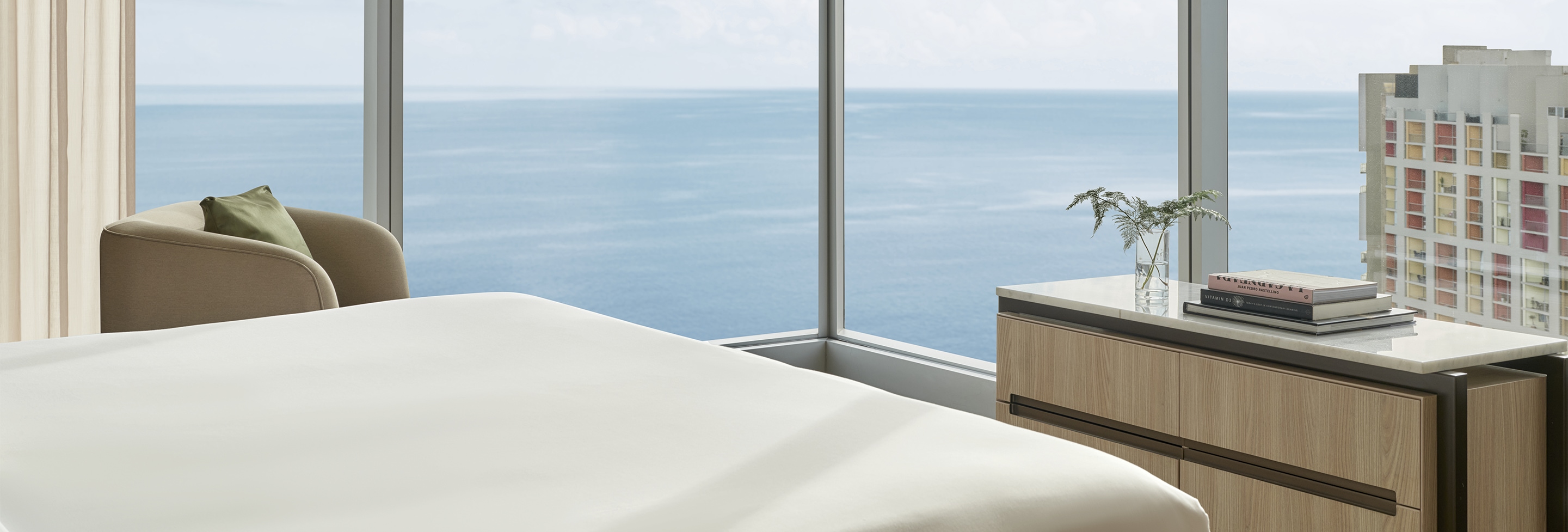 a bed with a view of the ocean