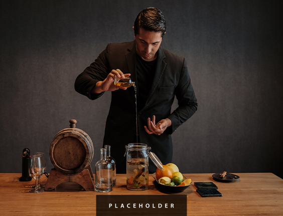 a man pouring liquid into a jar