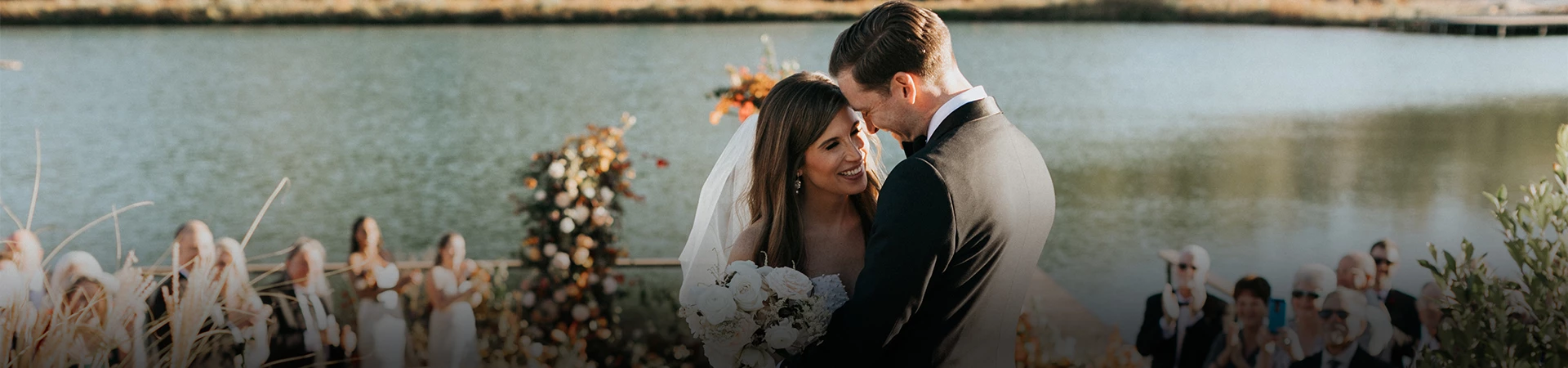 a man and woman smiling and hugging