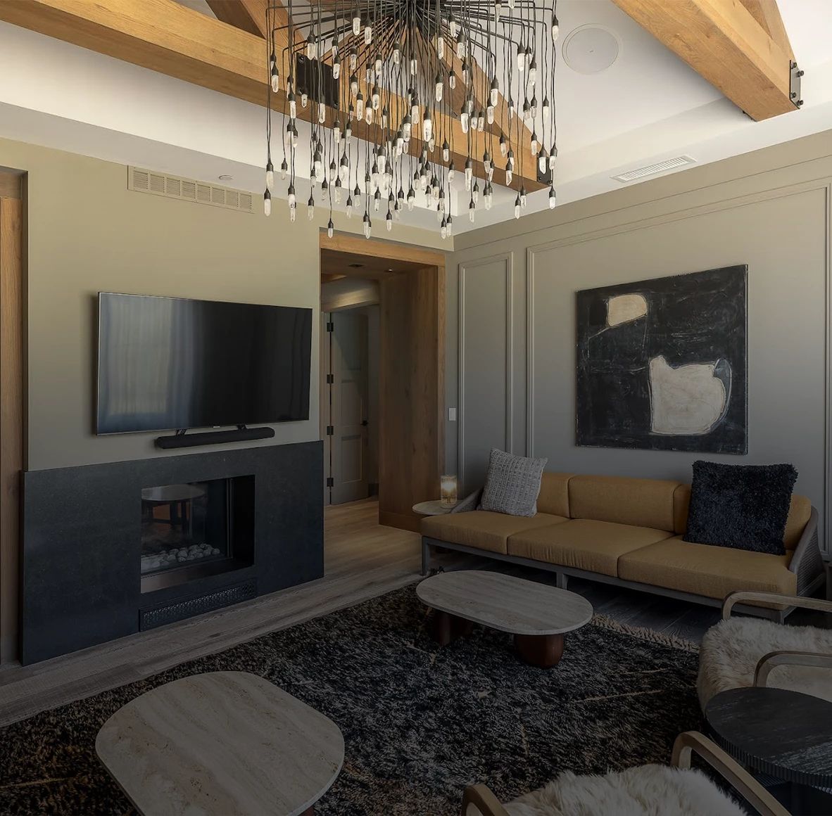 a living room with a chandelier and a fireplace