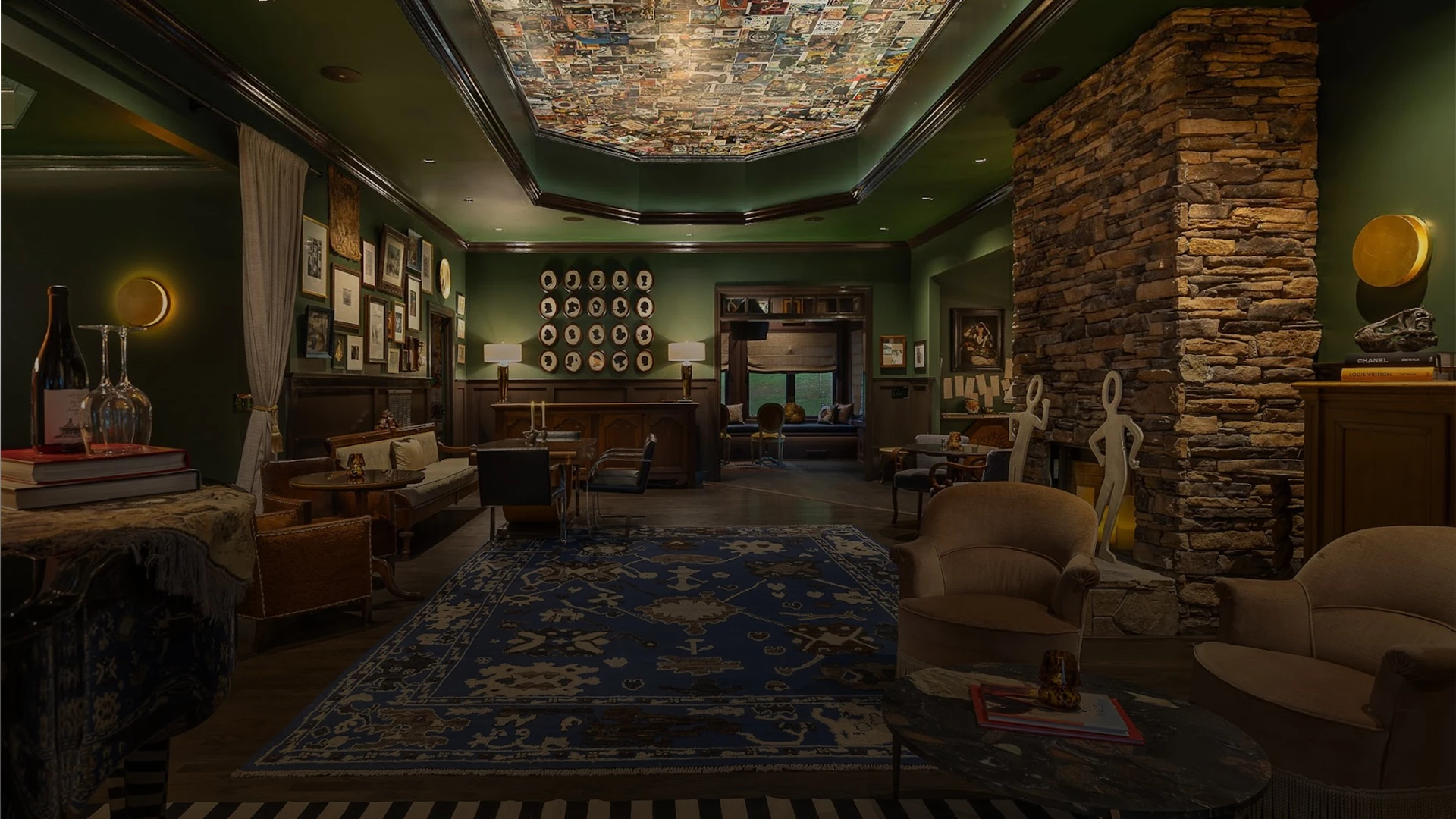 a room with a green ceiling and a blue rug and a couch