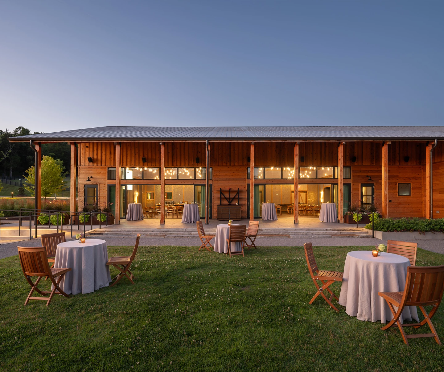 a building with tables and chairs in front of it