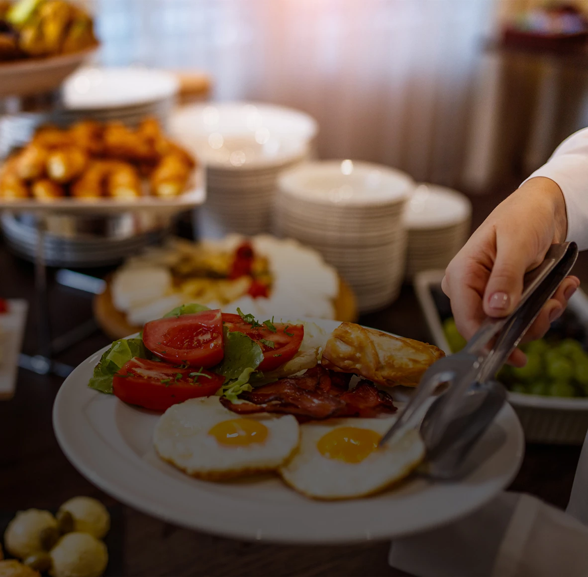 a person holding a plate of food