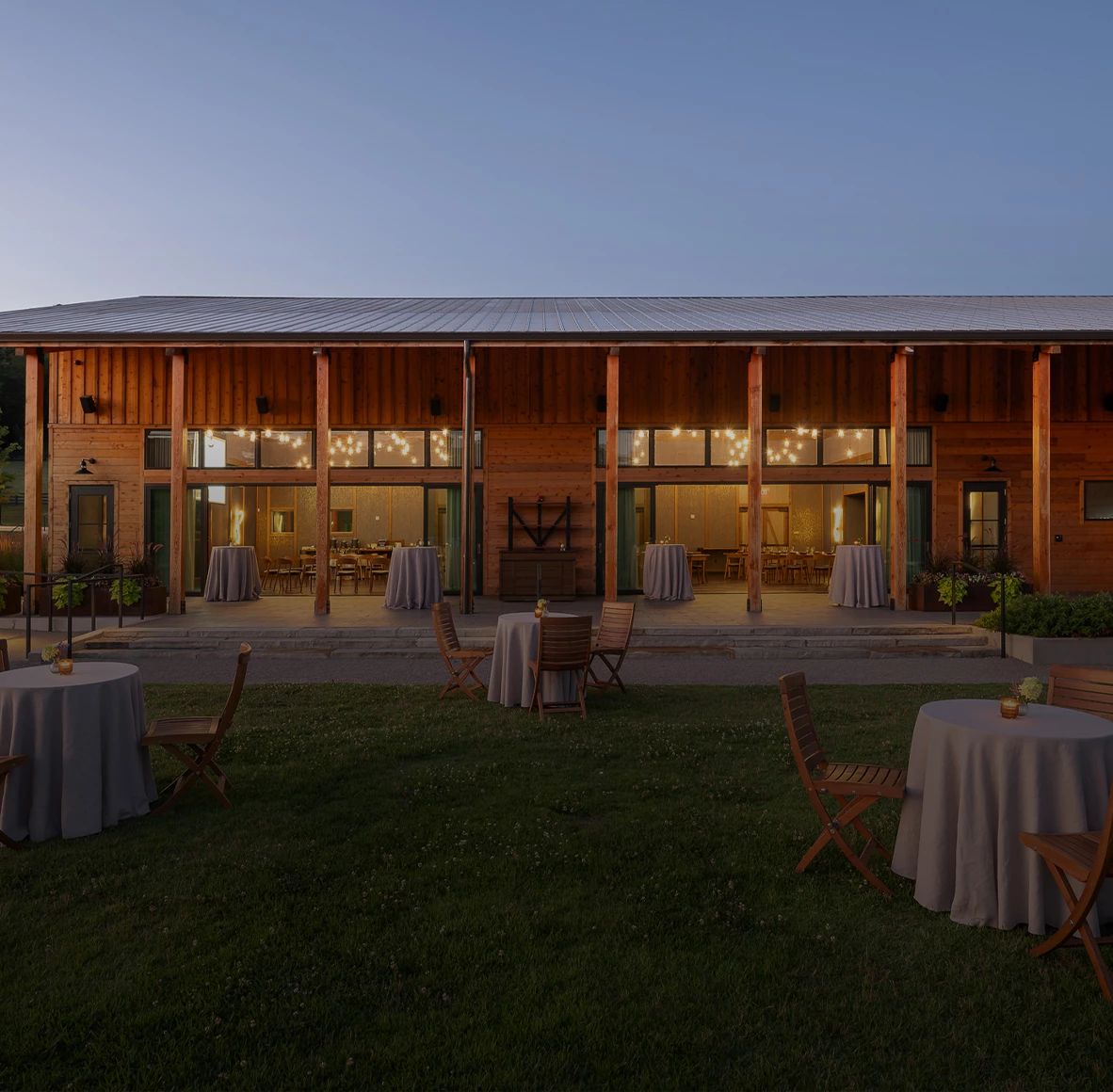 a building with tables and chairs outside