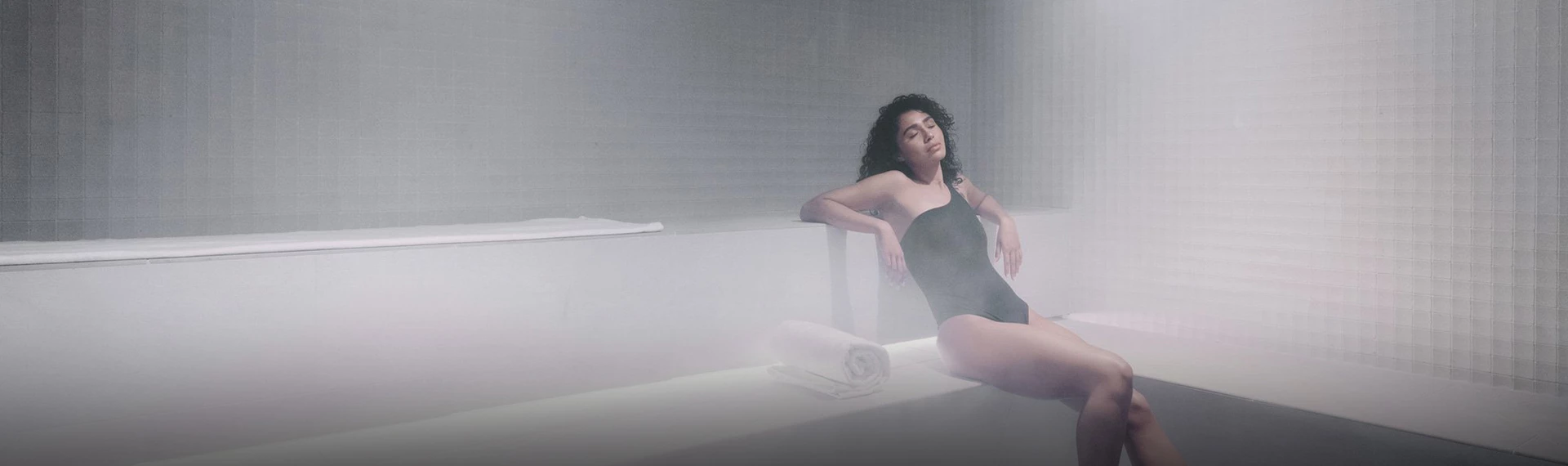 a woman sitting on a bathtub