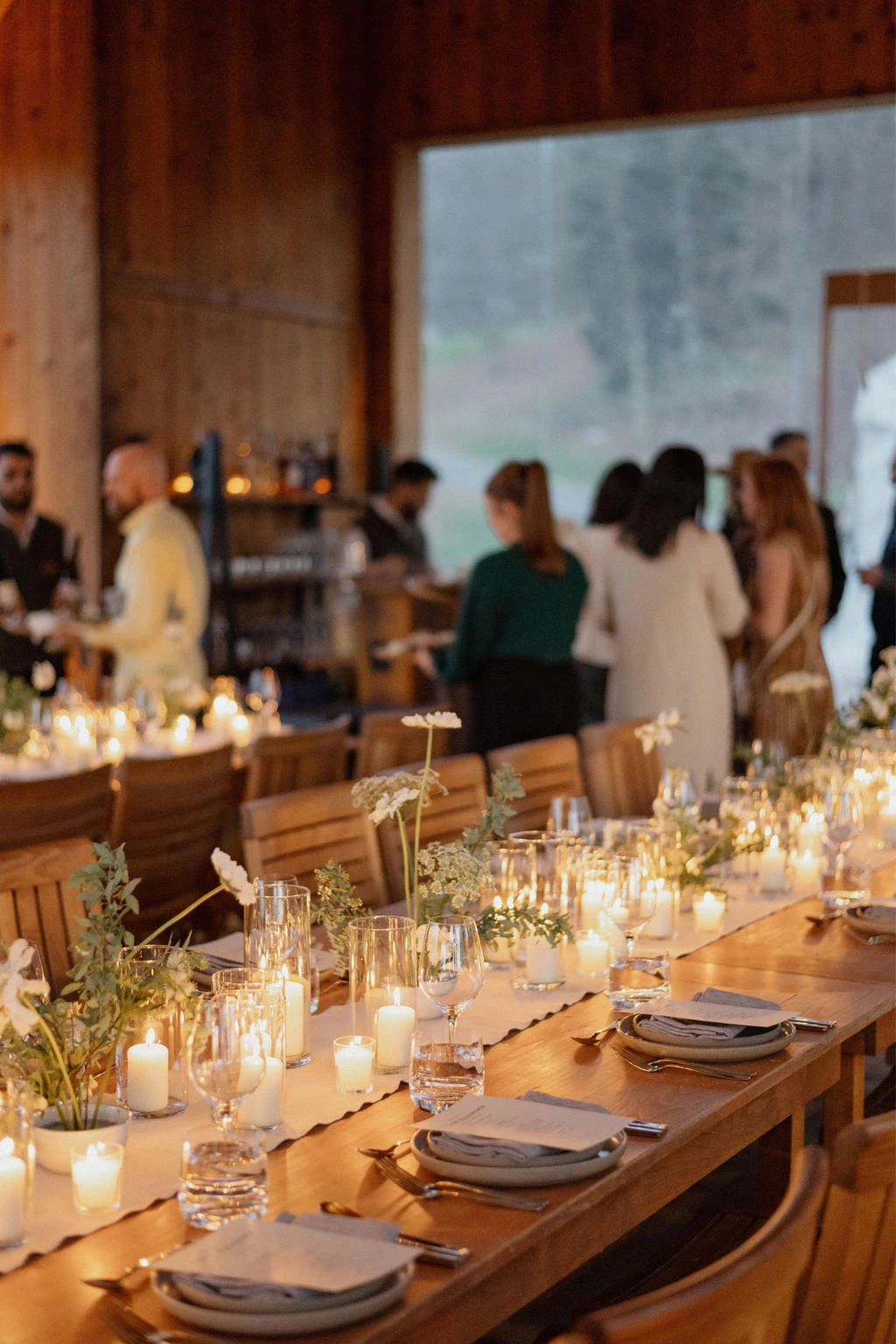 a long table with candles and flowers