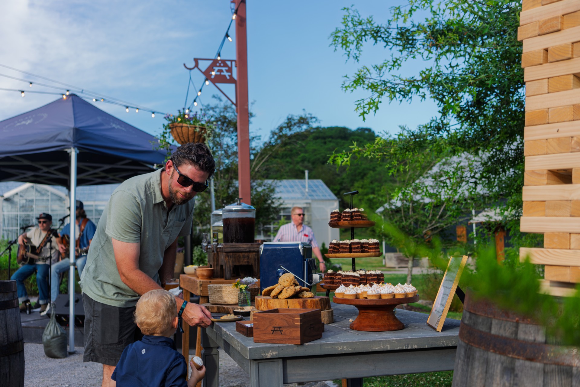 a man and child at a table with food