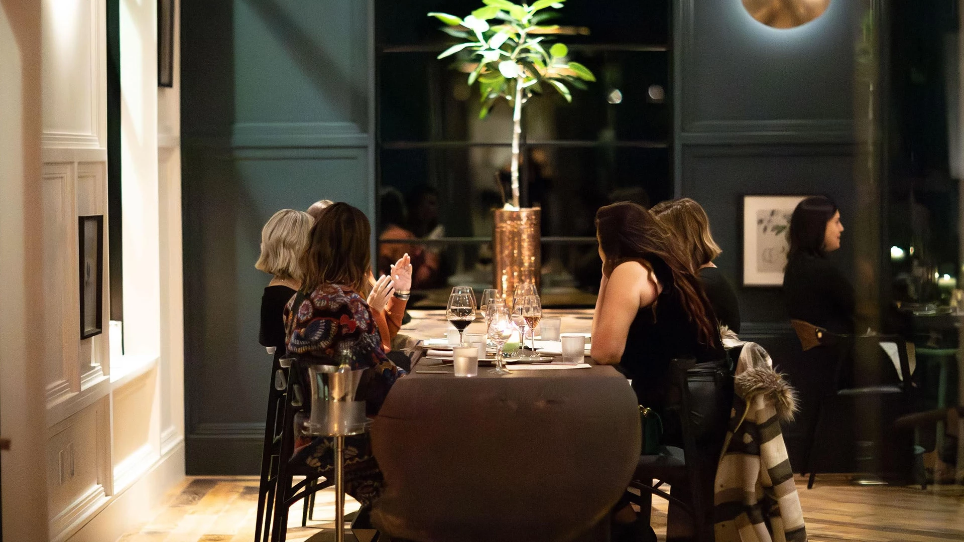 a group of people sitting at a table