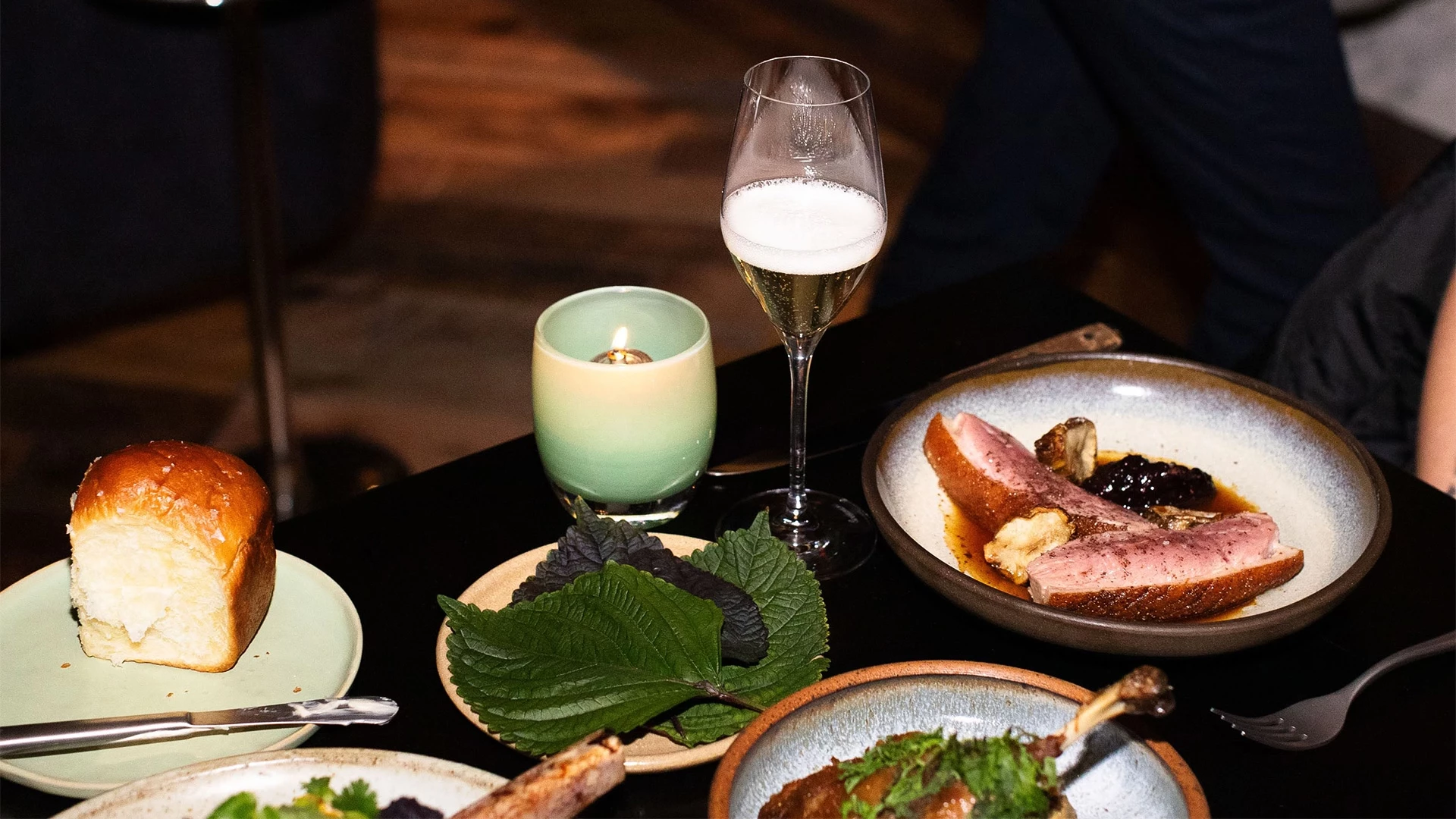a table with food and a candle