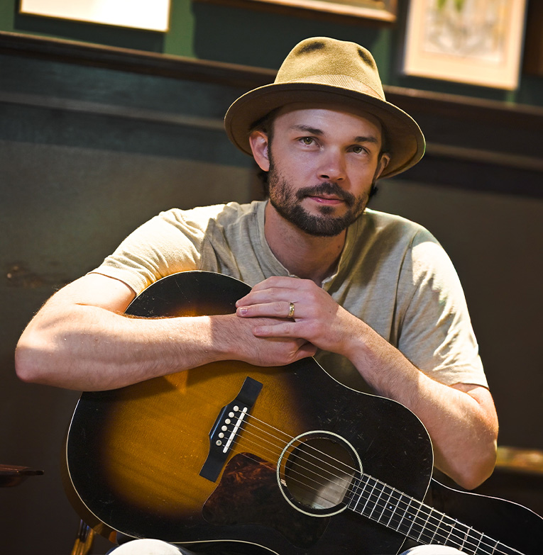 a man holding a guitar