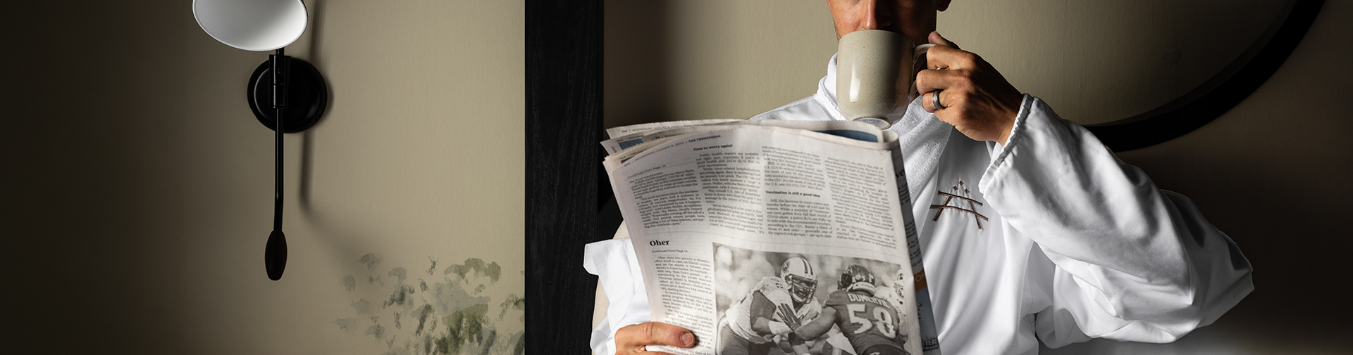 a man holding a newspaper