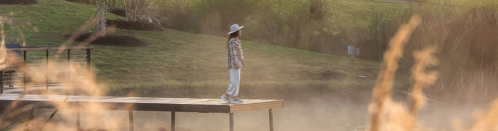a woman walking on a dock