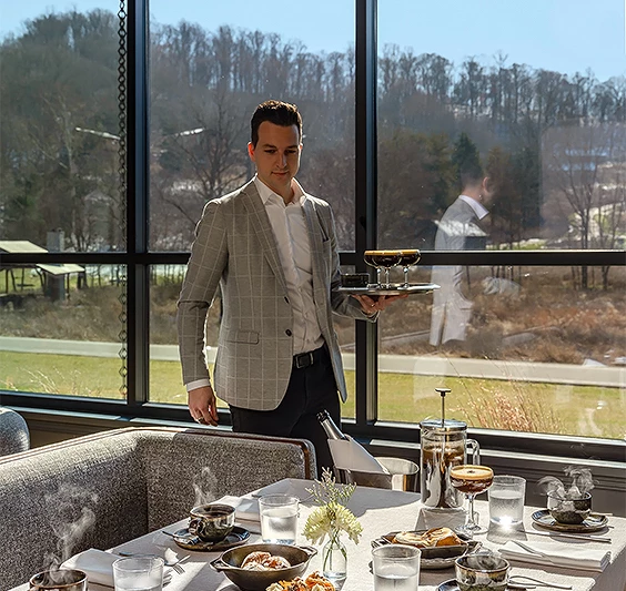 a man holding a tray of food