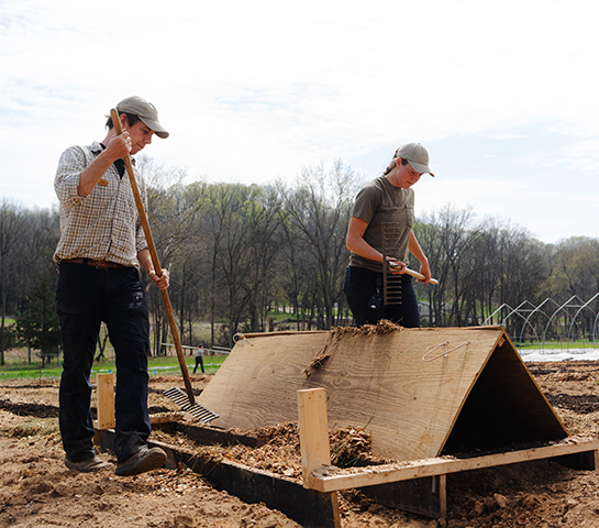 a couple of people working on a construction site