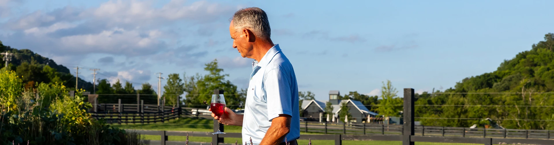 a man holding a glass of wine