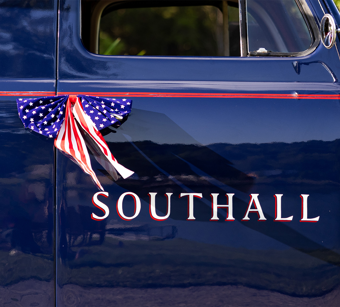 american flag bow on the side of a car