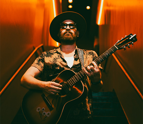 a man playing a guitar