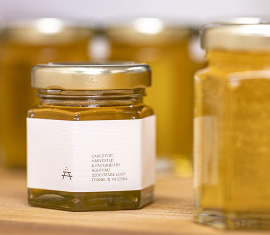 a jar of honey with a white label