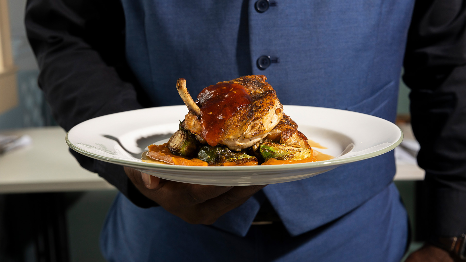 a person holding a plate of food