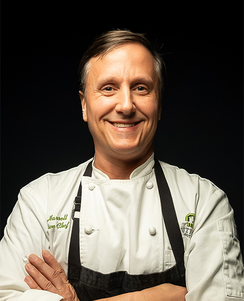 a man wearing a chef's uniform
