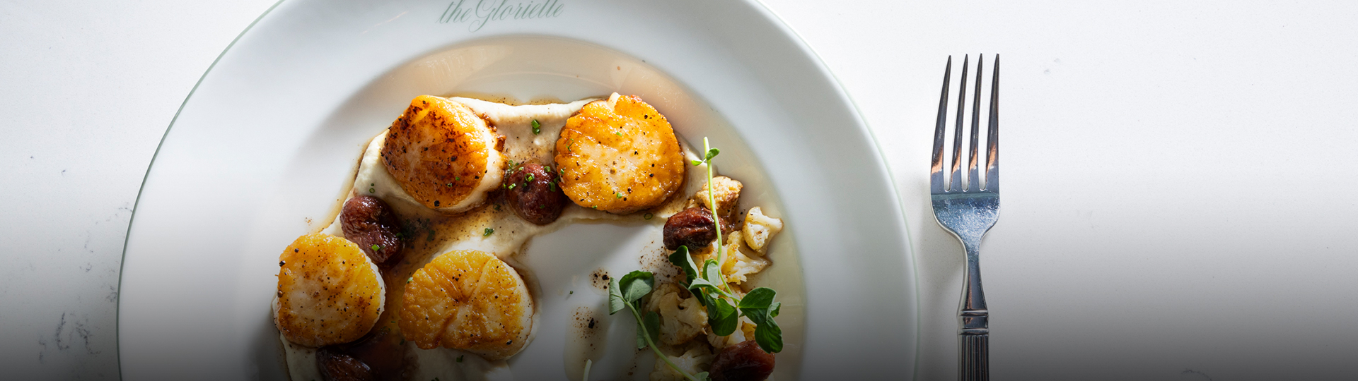 a plate of food on a white surface