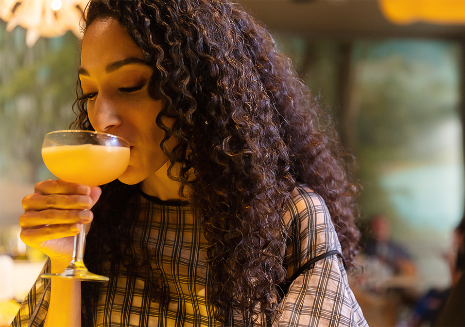 a woman drinking a drink