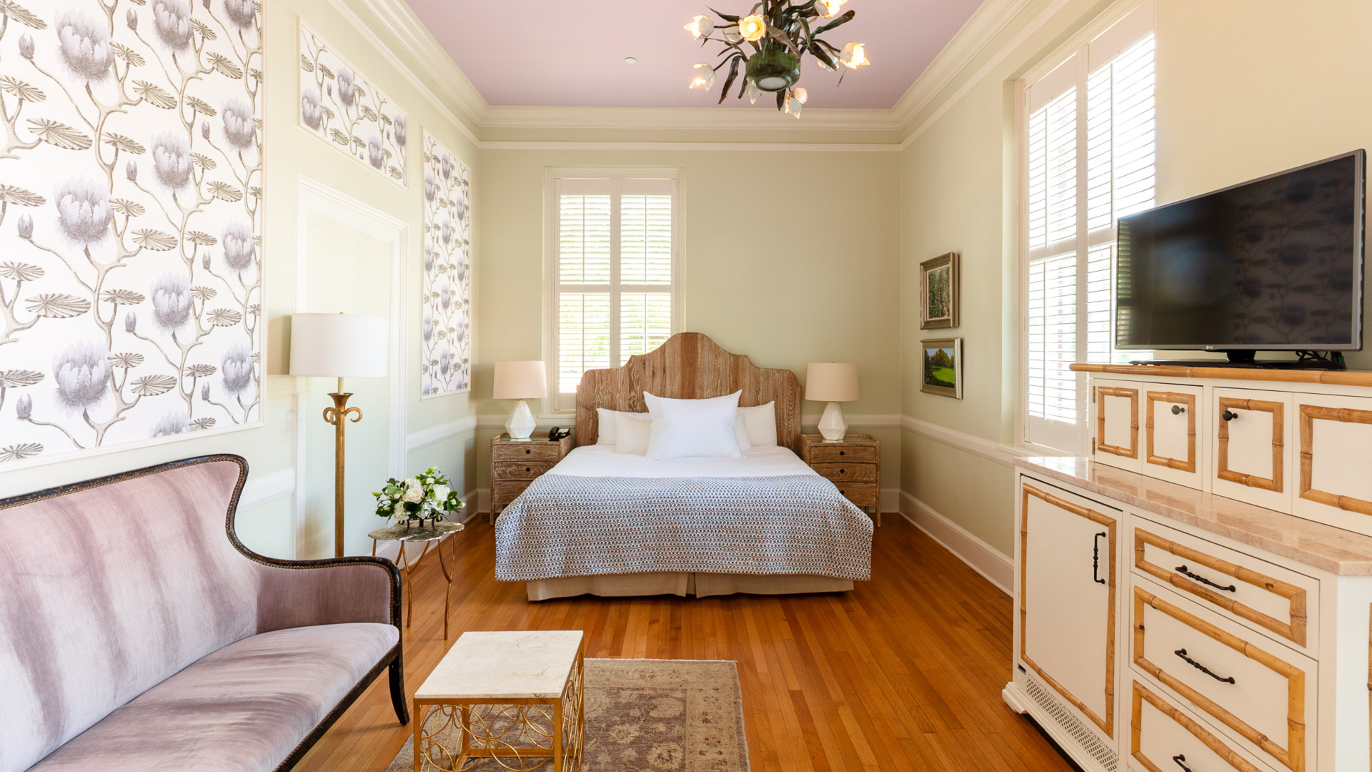 a bedroom with a bed and a couch