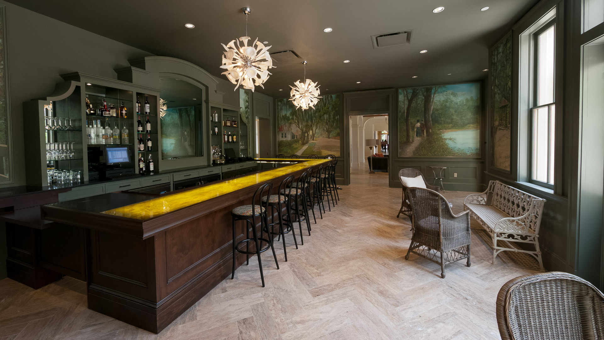 a bar with chairs and a table