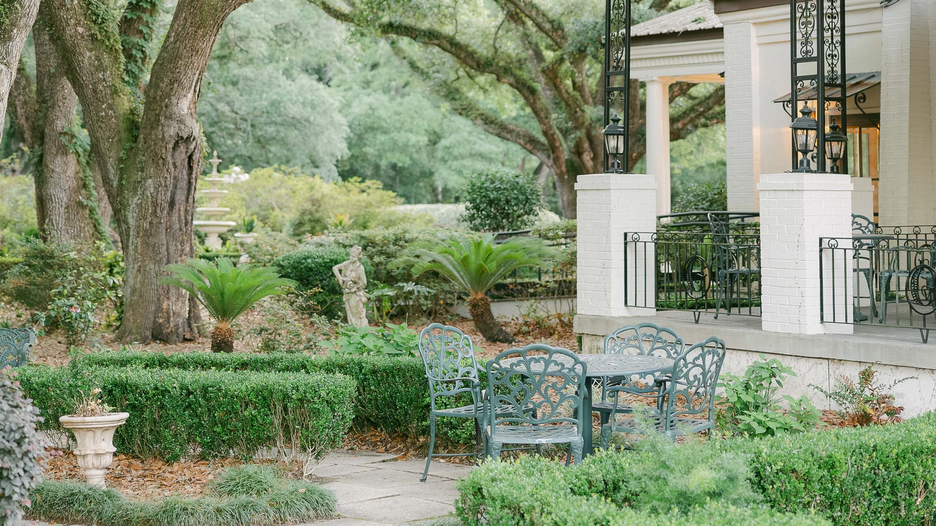 a table and chairs in a garden