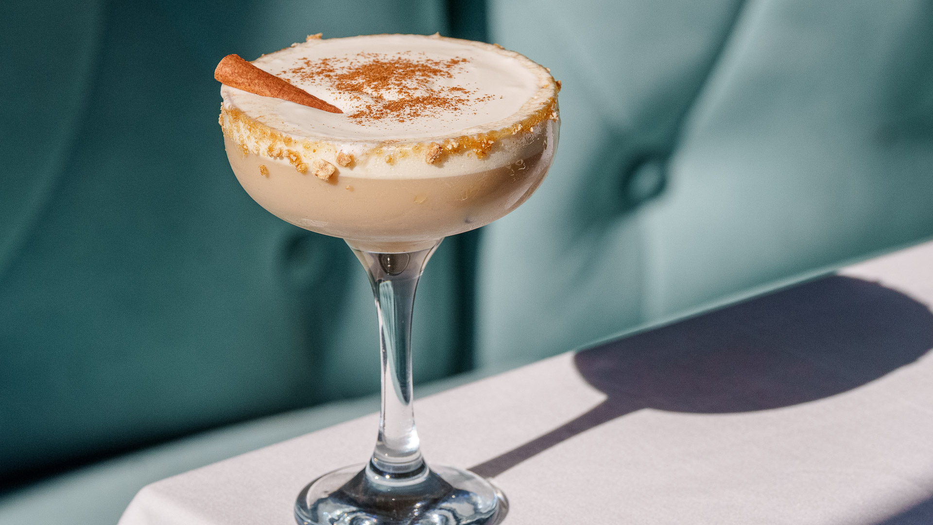 a glass with a drink on it